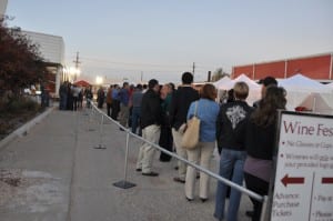 people standing in line at a wine festival