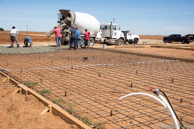18.03.22_untitled_021-660web | Bingham Family Vineyards men poring concrete for barrel room