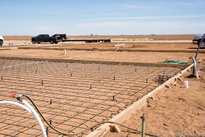 18.03.22_untitled_023-660web | Bingham Family Vineyards men poring concrete for barrel room