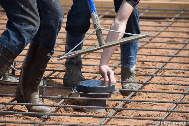18.03.22_untitled_033-660web | Bingham Family Vineyards men poring concrete for barrel room