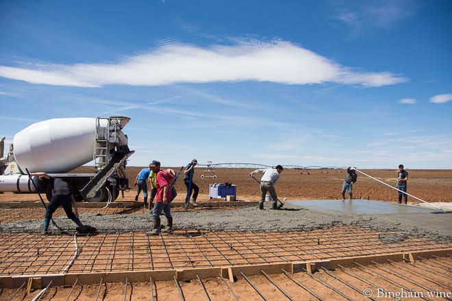 18.03.22_untitled_054-660web | Bingham Family Vineyards men poring concrete for barrel room