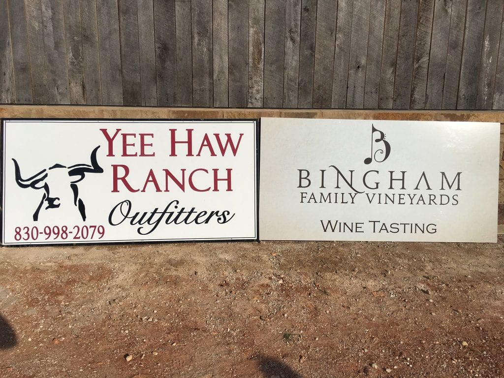 Yee Haw Ranch outfitters and Bingham Family Vineyards signs