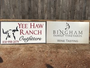 Yee Haw Ranch outfitters and Bingham Family Vineyards signs