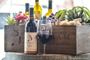 wine glass of bingham family vineyards 2016 Dirt Farmer and bottle