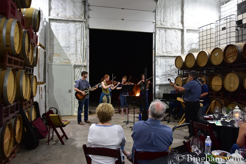 19.07.27_untitled_177-800web.4.5 | Bingham Family Vineyards people playing music at bingham family vineyard wine club dinner barrel room meadow Texas