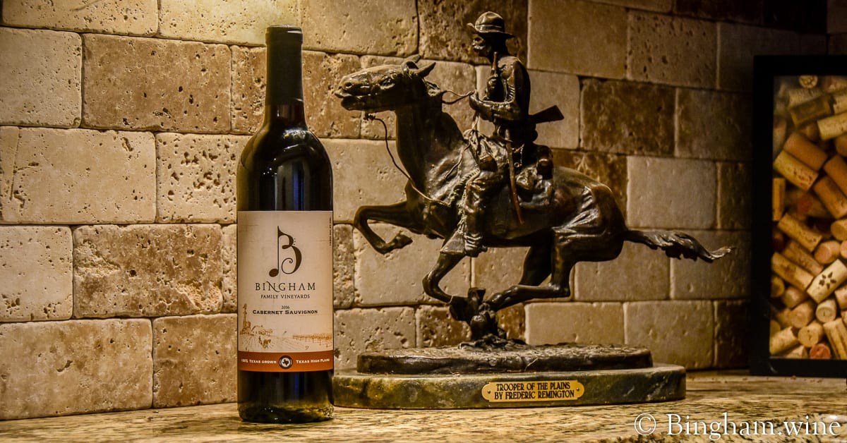 bingham family vineyards 2016 cabernet sauvignon next to bronze statute