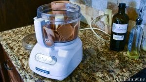 20.05.23_untitled_023-1200x675(16x9) | Bingham Family Vineyards first layer graham cracker layer of S'more Cupcake being made