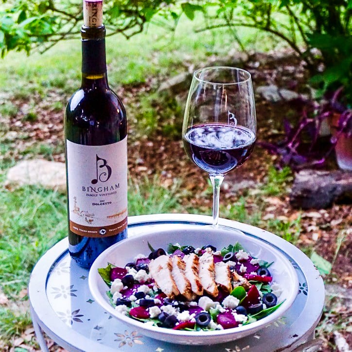 Dolcetto-pairing-.1200.web_.ShannonB | Bingham Family Vineyards chicken salad with bottle bingham family vineyard 2017 dolcetto and glass of wine