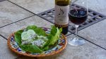 Chicken salad with a bottle of bingham family vineyard turnrow and glass