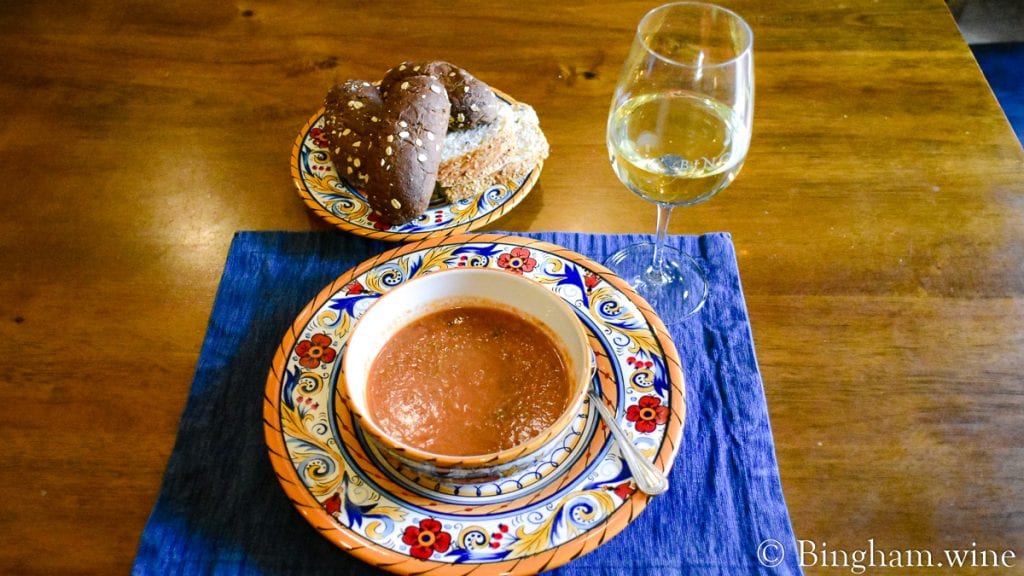 tomato gazpacho and bread rolls with a glass of vermentino