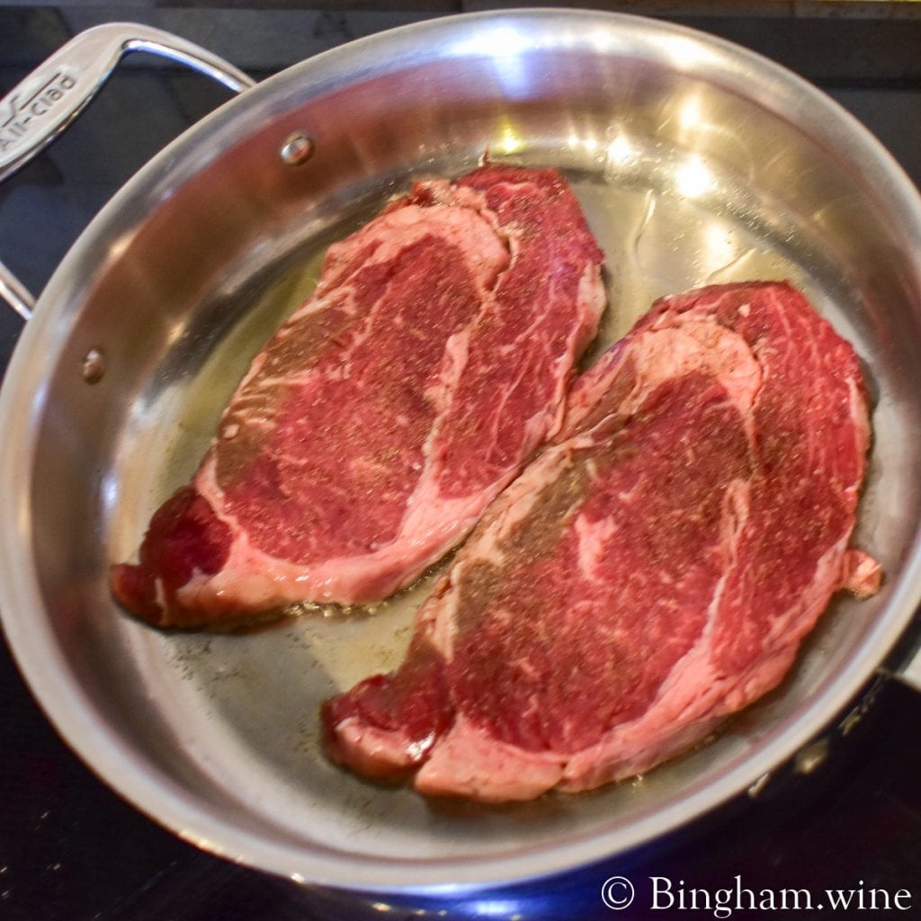 20.07.17_R.Merlot.Steak_.HotGlaze_002.1200.web_.1x1 | Bingham Family Vineyards steak cooking in a pan