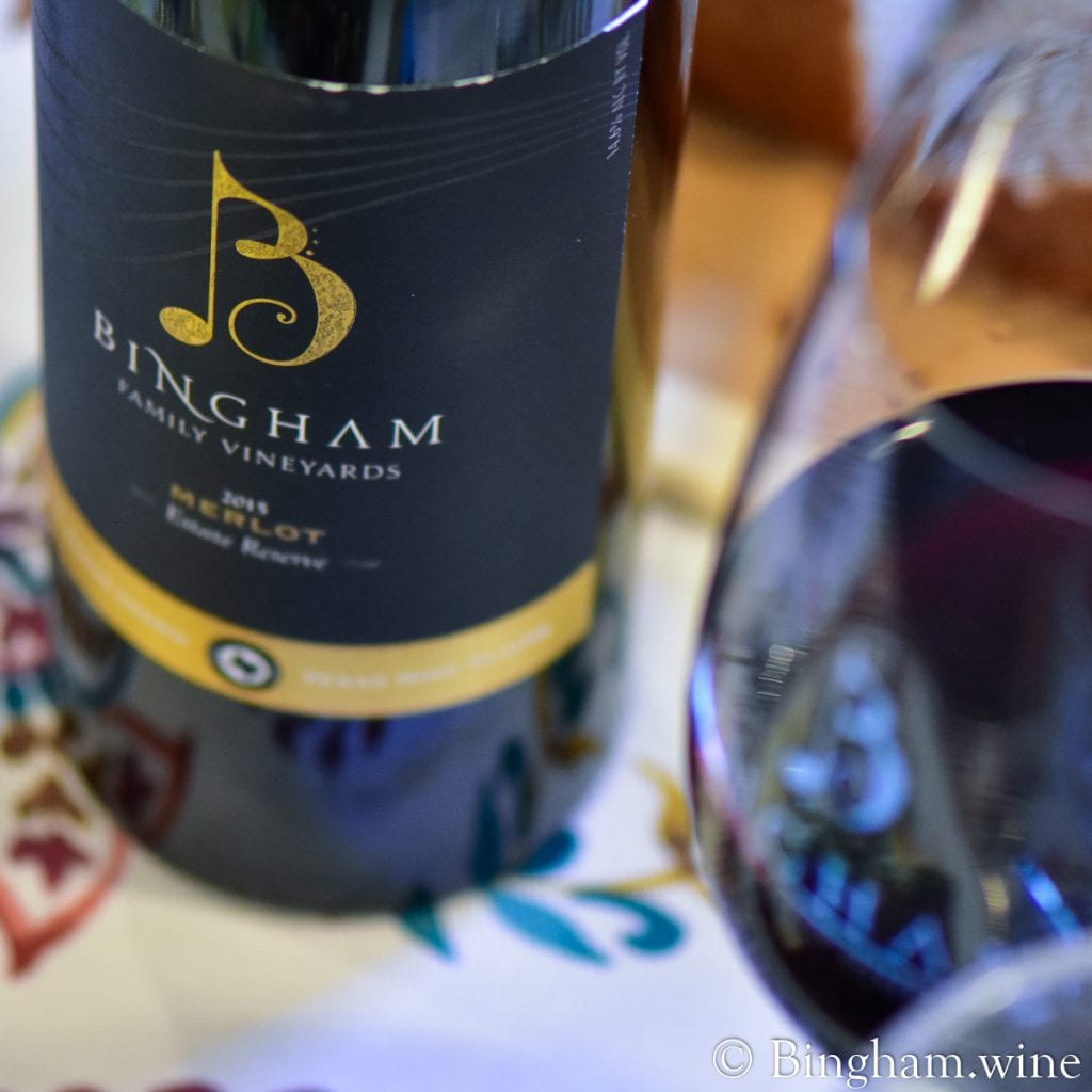 20.07.17_R.Merlot.Steak_.HotGlaze_007.1200.web_.1x1 | Bingham Family Vineyards bottle of bingham family vineyards 2015 reserve merlot and wine glass