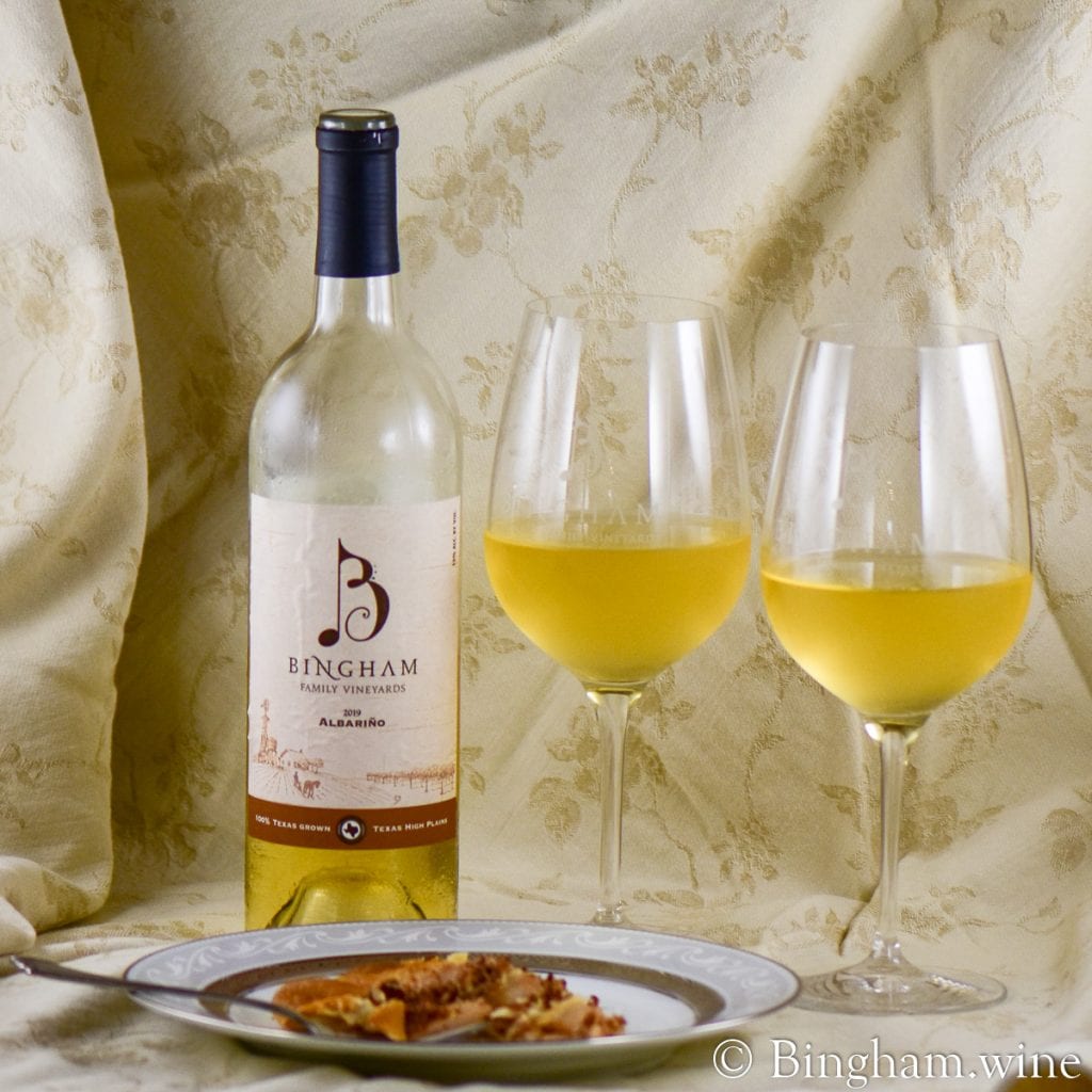 20.07.29_PearPecan.19.Albarino_052.1200.web_.1x1-1 | Bingham Family Vineyards pear pecan pastry a bottle of bingham family vineyards 2019 Albarino and glasses of wine