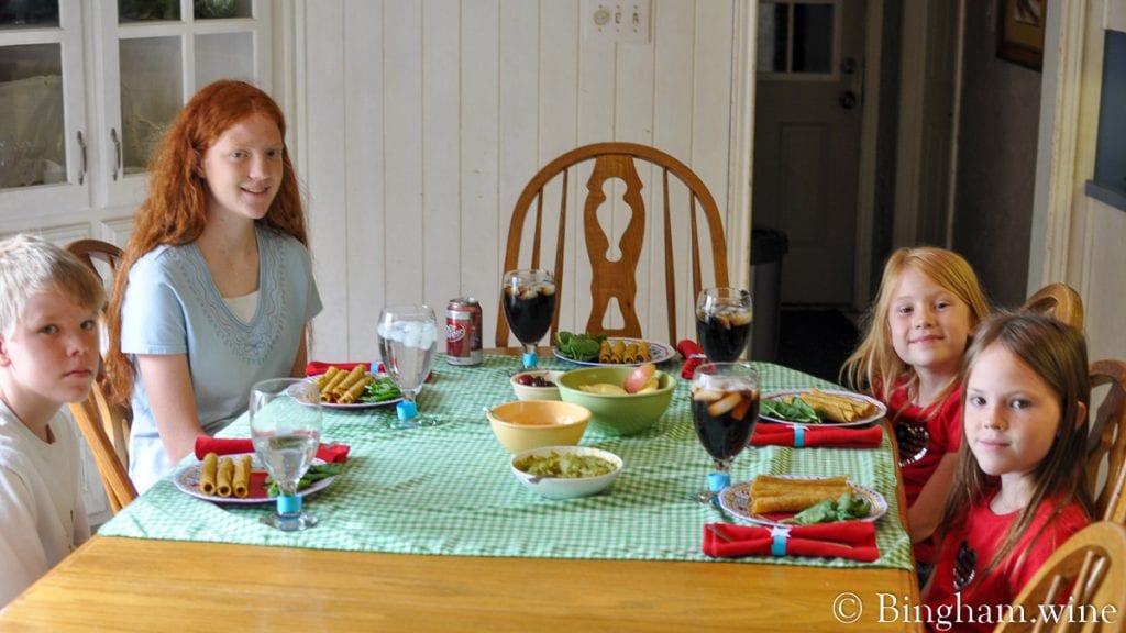 10.07.04_4thJulyDinner_005-1200-web-16x9-1 | Bingham Family Vineyards Four children seated at dinner table.