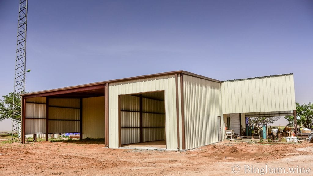 21.05.21_wineryfarmconstruction_010-1080-web-16x9-1 | Bingham Family Vineyards tractor hanger in barn bingham family vineyard meadow Texas