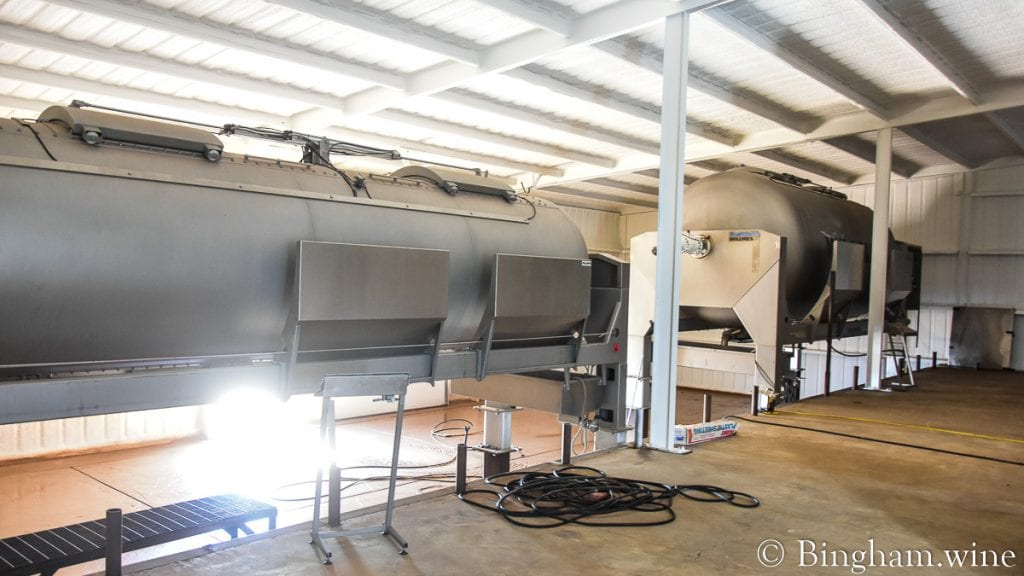 21.07.04_winery_004-2-1080-web-16x9-1 | Bingham Family Vineyards An 18 ton and 35 ton crush machine at Bingham Family Vineyards