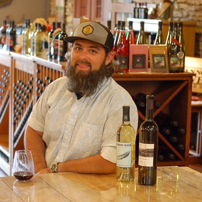 20.07.10_SamJennings-Amandaphoto-_003.1200.web_.1x1 | Bingham Family Vineyards Sam Jennings posed with wine bottles.