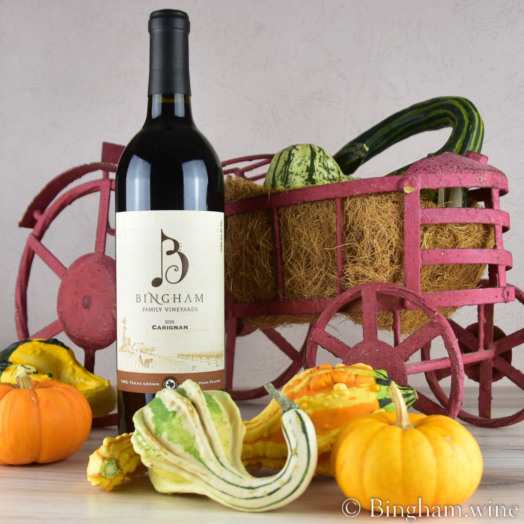 221028_2019Carignan_0051200web_1x1 | Bingham Family Vineyards Bingham Carignan wine with red metal tractor and gourds grown on the farm.