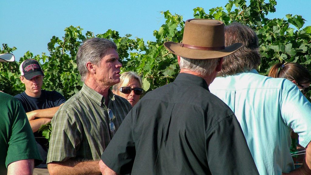 090712_grapetastingclass_002-1200-web-16x9 | Bingham Family Vineyards visitors looking at vines at Bingham Family Vineyards with Cliff Bingham