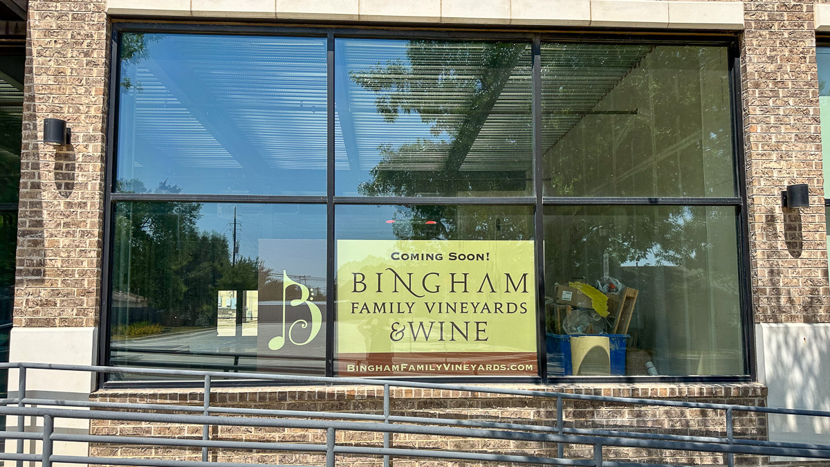 Coming Soon! sign in front window at new Bingham Family Vineyards, Roanoke, Texas, tasting room.