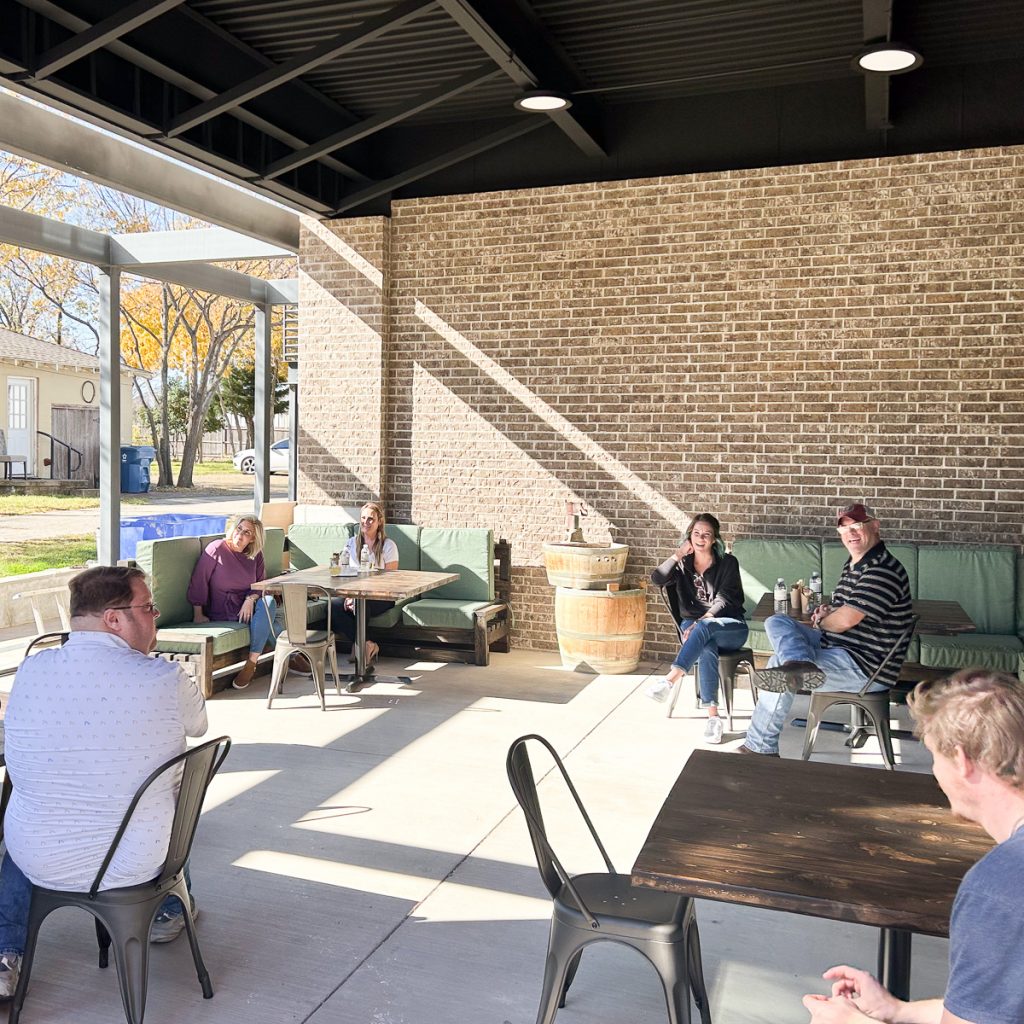 23.12.08_Roanoke.Jenn.Chase3_003.1200.web.1x1 | Bingham Family Vineyards People seated on the patio enjoying a sneak preview of Bingham Family Vineyards, Roanoke, Texas, location