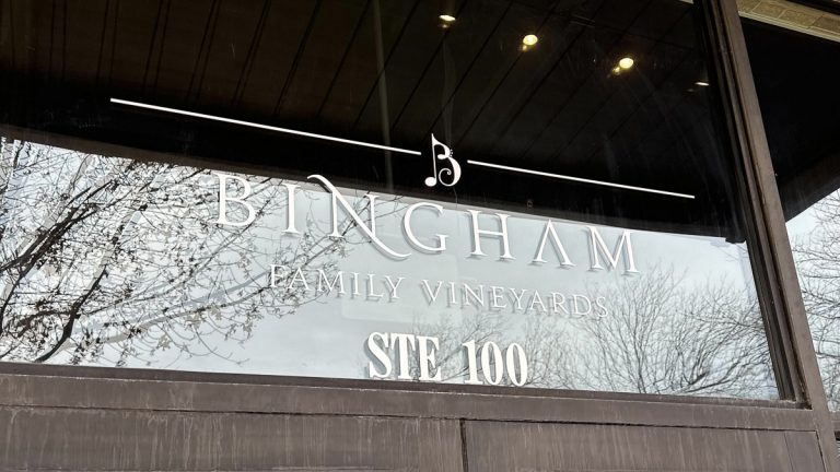 Sign on the glass above the front doors at Bingham Family Vineyards, Roanoke, Texas
