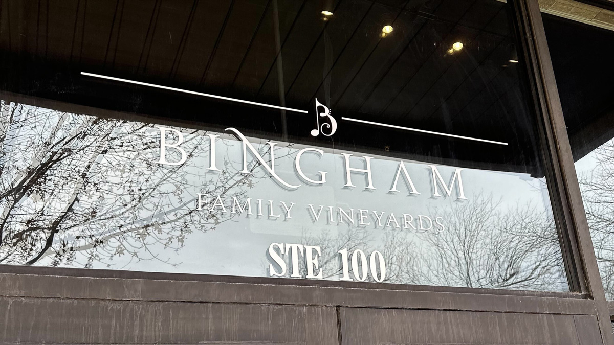 Sign on the glass above the front doors at Bingham Family Vineyards, Roanoke, Texas