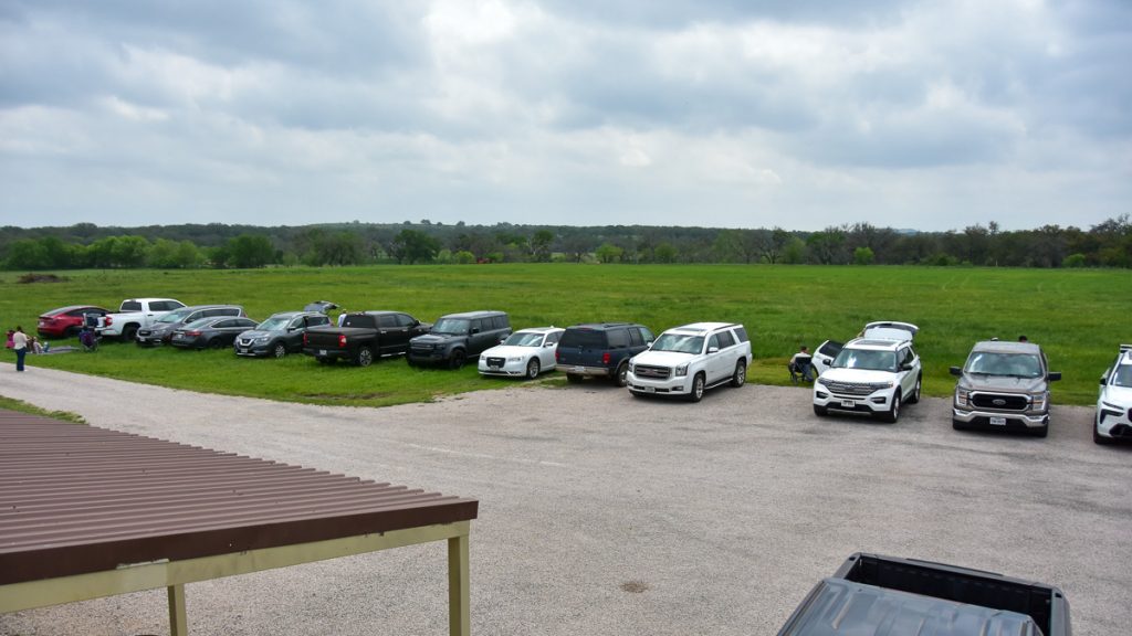 240408_HyeEclipse_022-1200-web-16x9 | Bingham Family Vineyards Cars lined up belonging to people watching the solar eclipse on April 8, 2024 at Bingham Family Vineyards, Hye, Texas