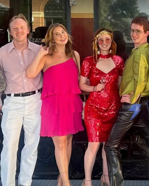 People posing dressed in Disco attire for the Grapevine Disco Train at Historic Grapevine, Texas railroad