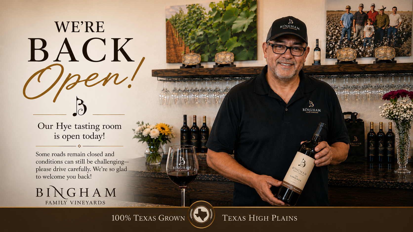 J.R. holding bottle of Bingham Wine at Bingham Family Vineyards Hye Tasting Room welcoming people back after being closed because of heavy rains.